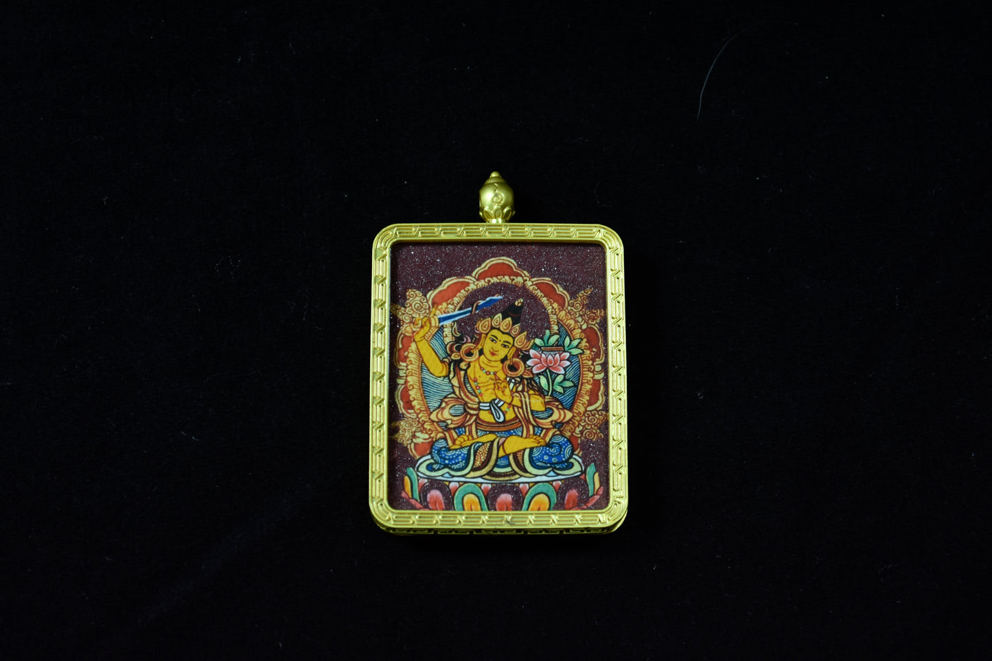 Decorative pendant with a colorful design on a black background