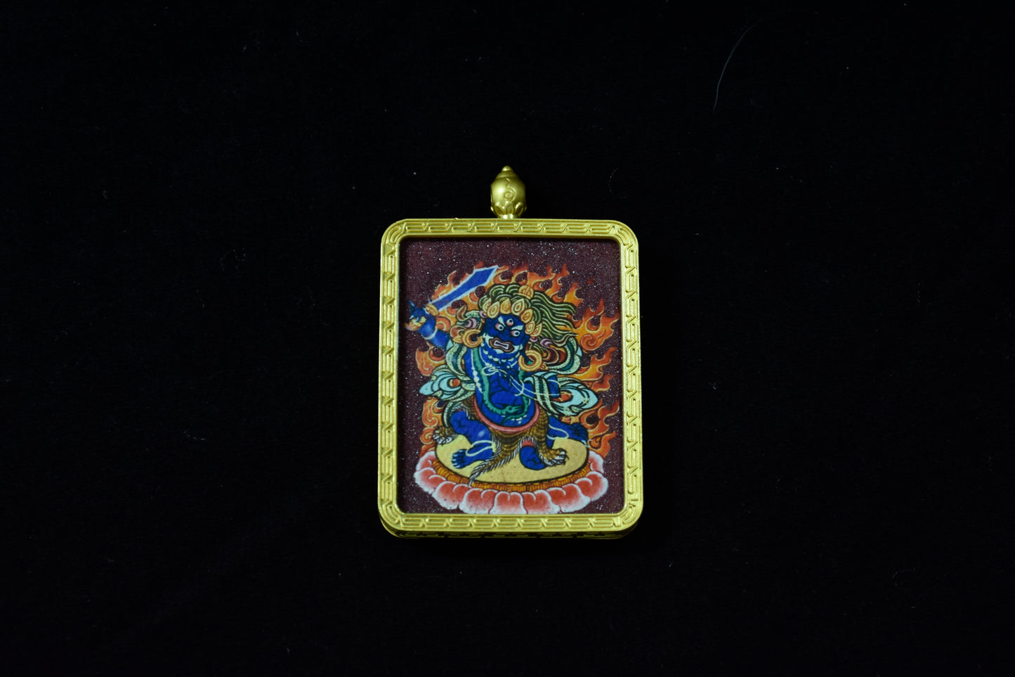 Decorative pendant with a colorful design on a black background