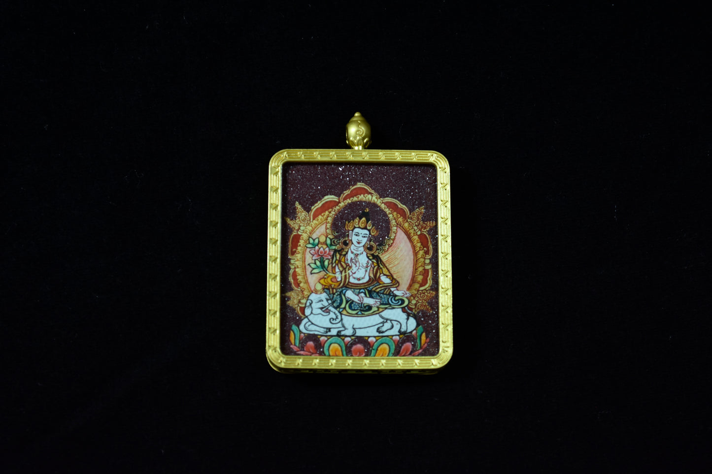 Pendant with a religious figure in a gold frame on a black background
