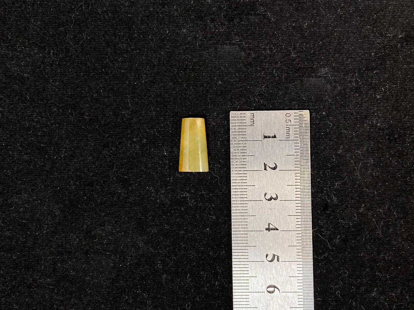 This honey colored jade features a half round shape.