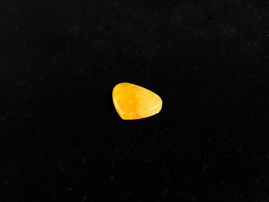 A yellow heart-shaped jadeite.