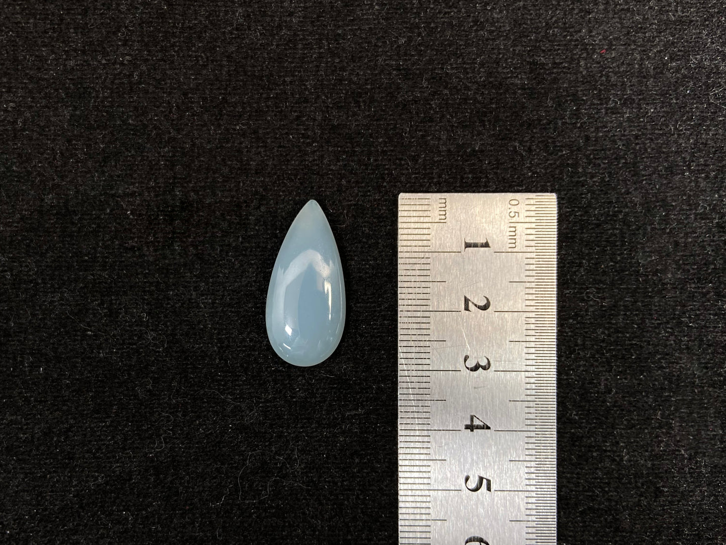 A blue, semi-transparent teardrop jadeite.