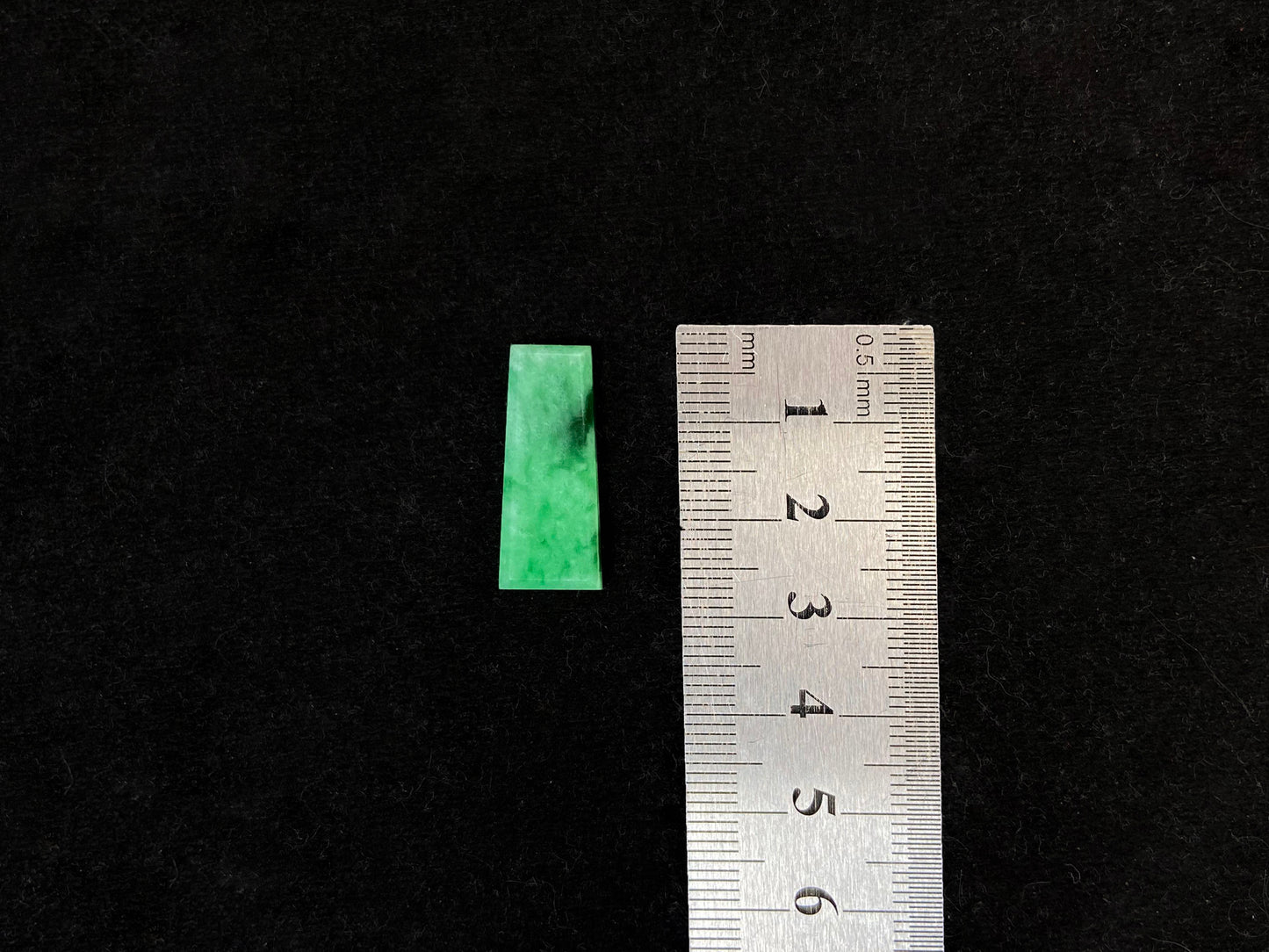 This Wu Shi Pai features a light white green background with deep green markings.