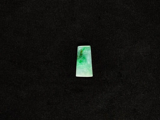 The jadeite wushi plaque presents a clean white base adorned with natural green veining.