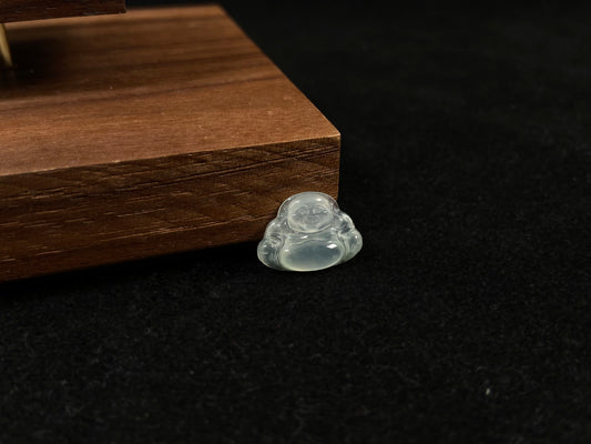 A transparent jade Buddha carving.