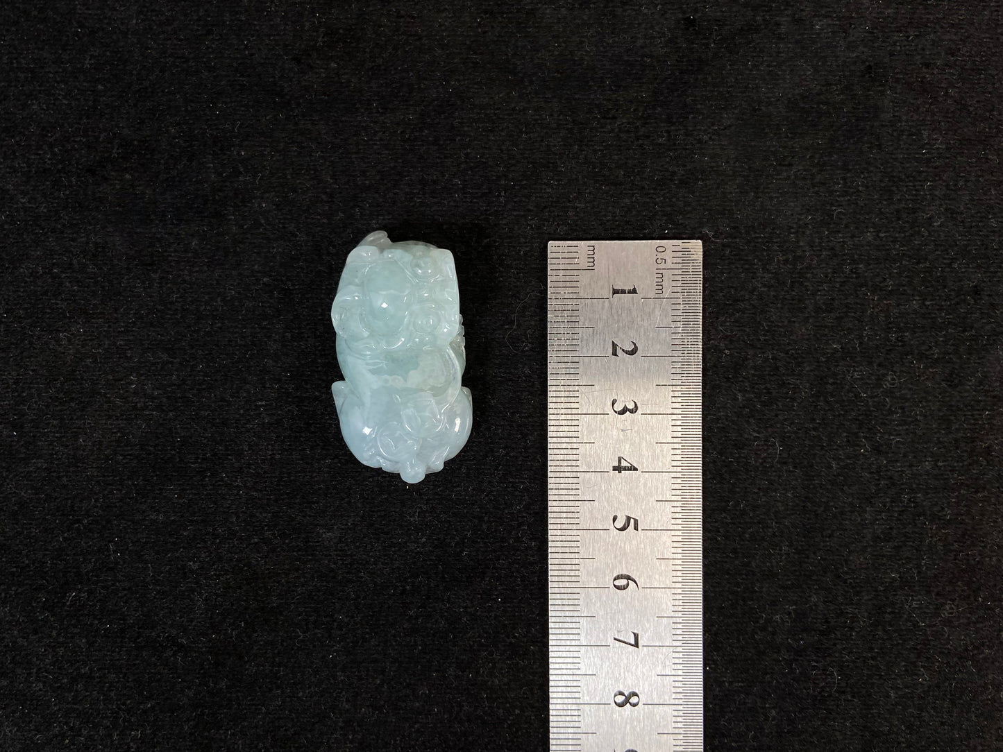 A light green translucent jade Pi Xiu carving.