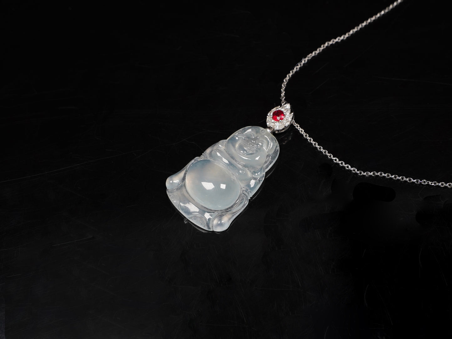 This icy jadeite Buddha pendant.