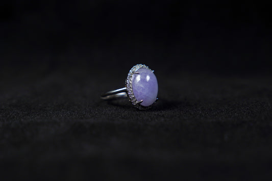 This is a purple cabochon jadeite ring.