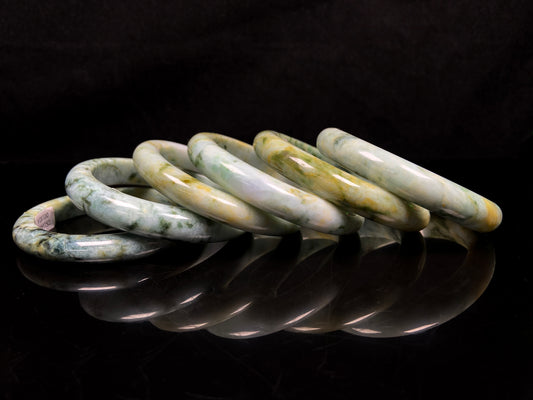 Mossy green with honeyed veins jadeite bangle.