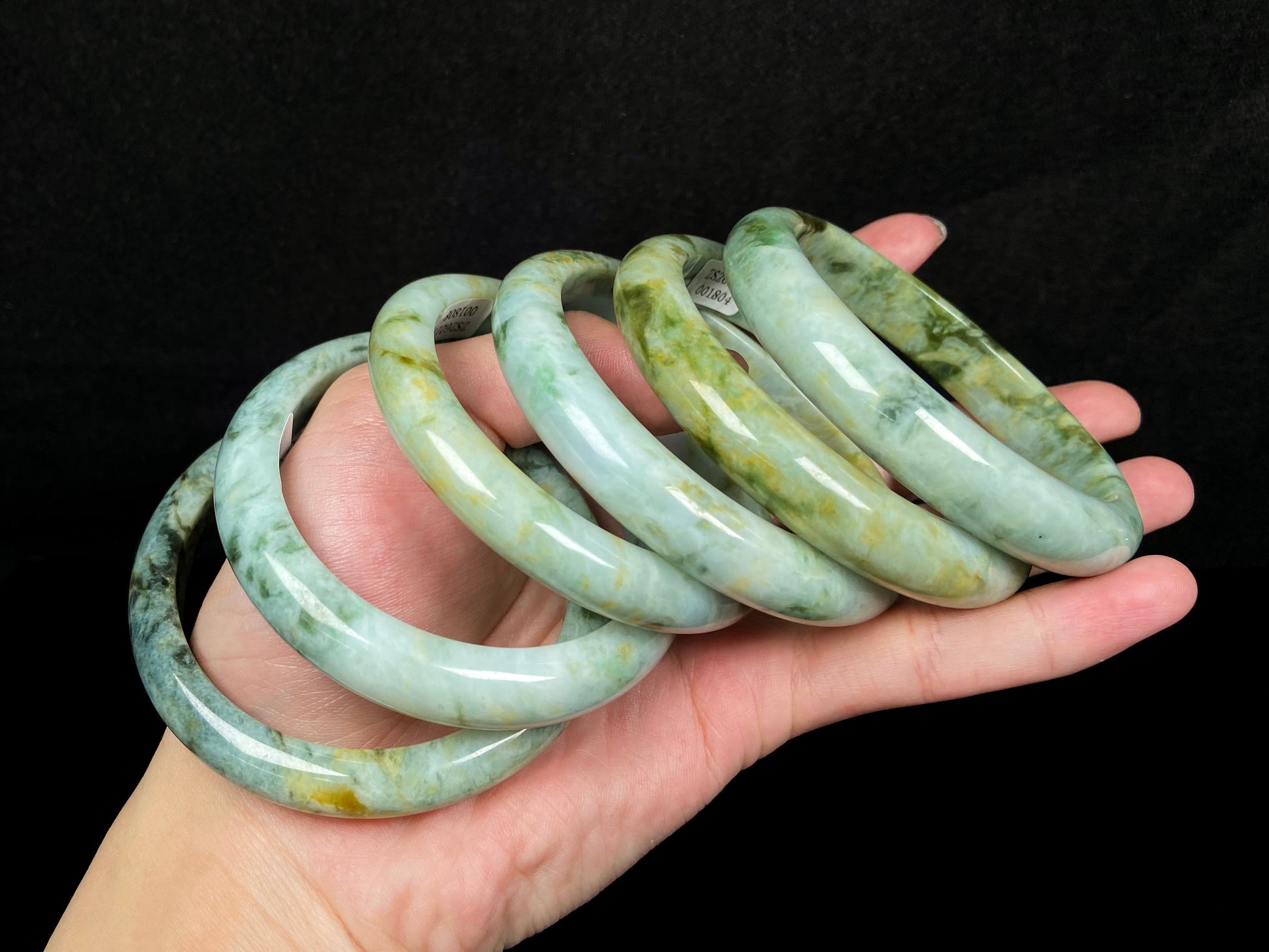 Mossy green with honeyed veins jadeite bangle.