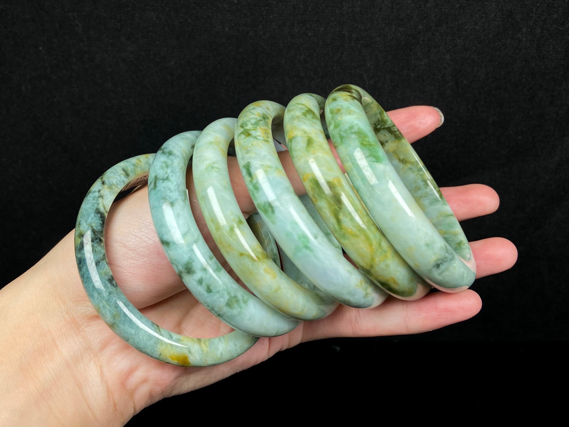 Mossy green with honeyed veins jadeite bangle.