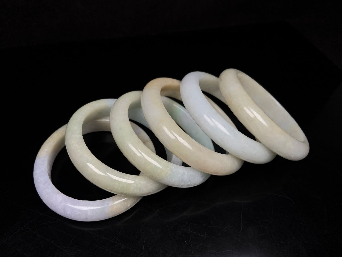 Golden shimmers sprinkling lightly jadeite bangle.