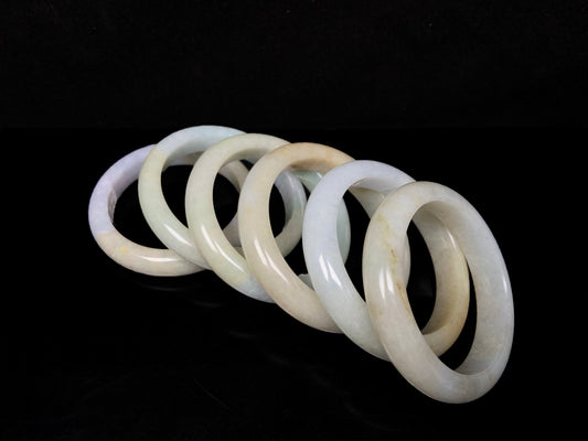 Golden shimmers sprinkling lightly jadeite bangle.