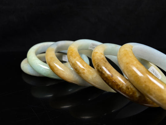 A golden dust sprinkled gently jadeite bangle.
