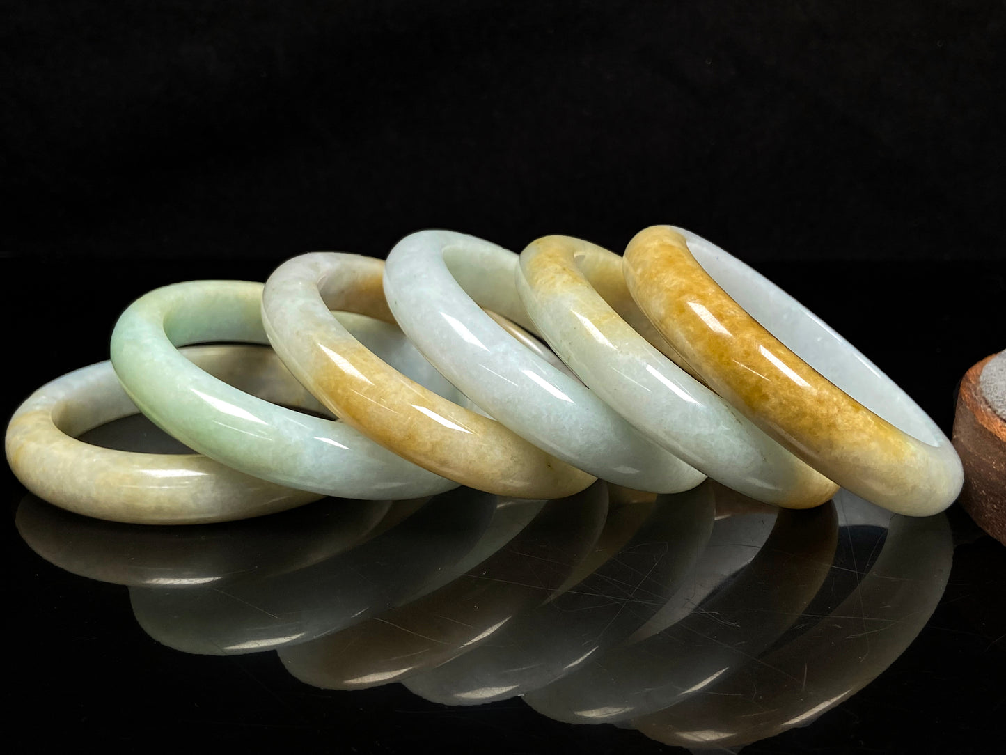 A golden dust sprinkled gently jadeite bangle.