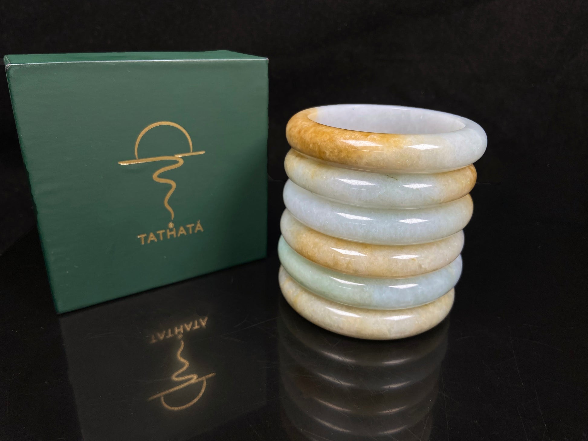 A golden dust sprinkled gently jadeite bangle.