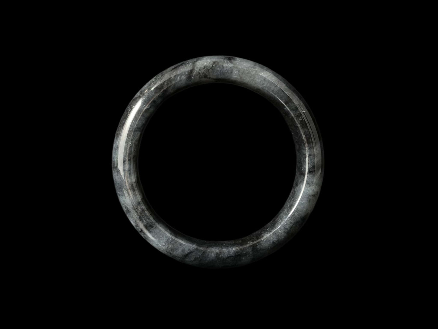 A grey cloud veil jadeite bangle.