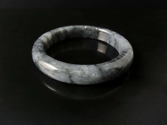 A grey cloud veil jadeite bangle.