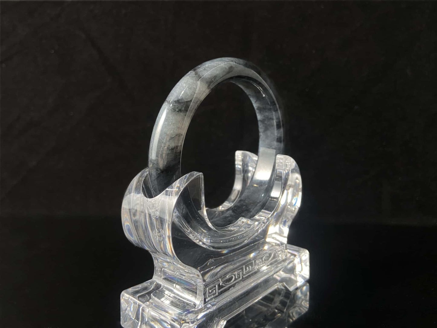 A grey cloud veil jadeite bangle.