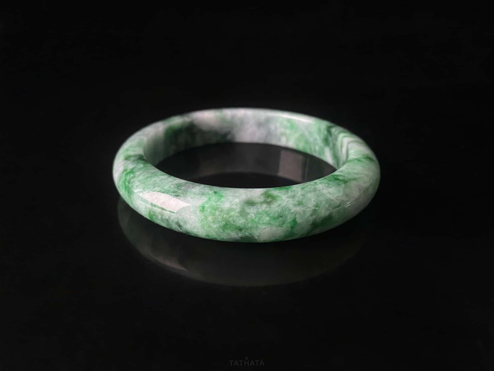 A mossy forest veil jadeite bangle.