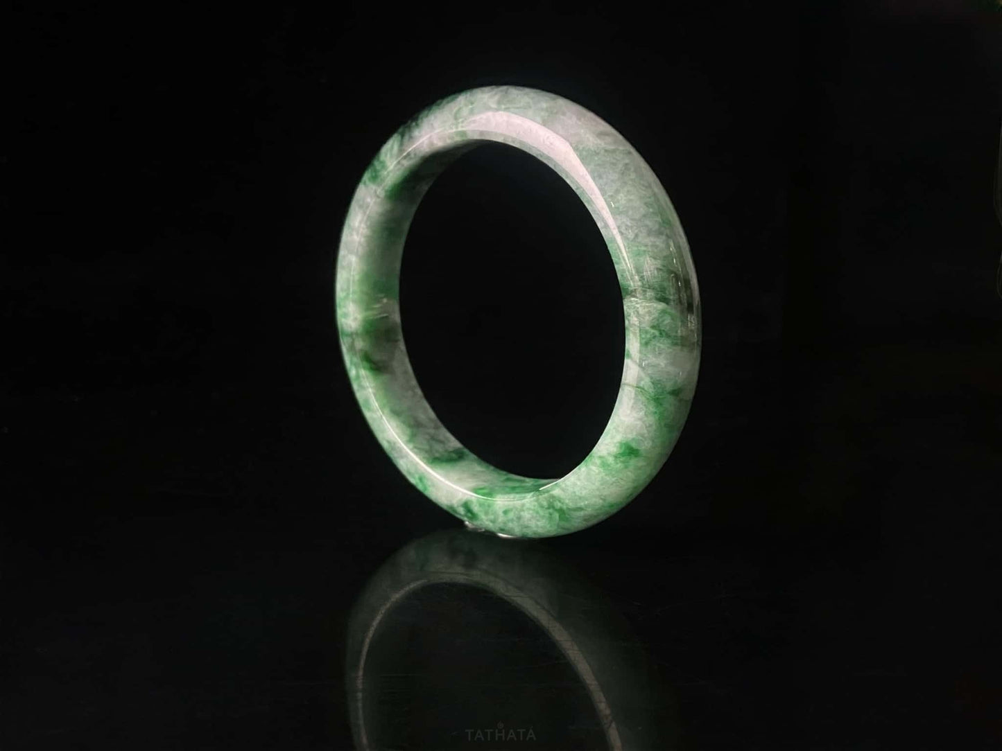 A mossy forest veil jadeite bangle.