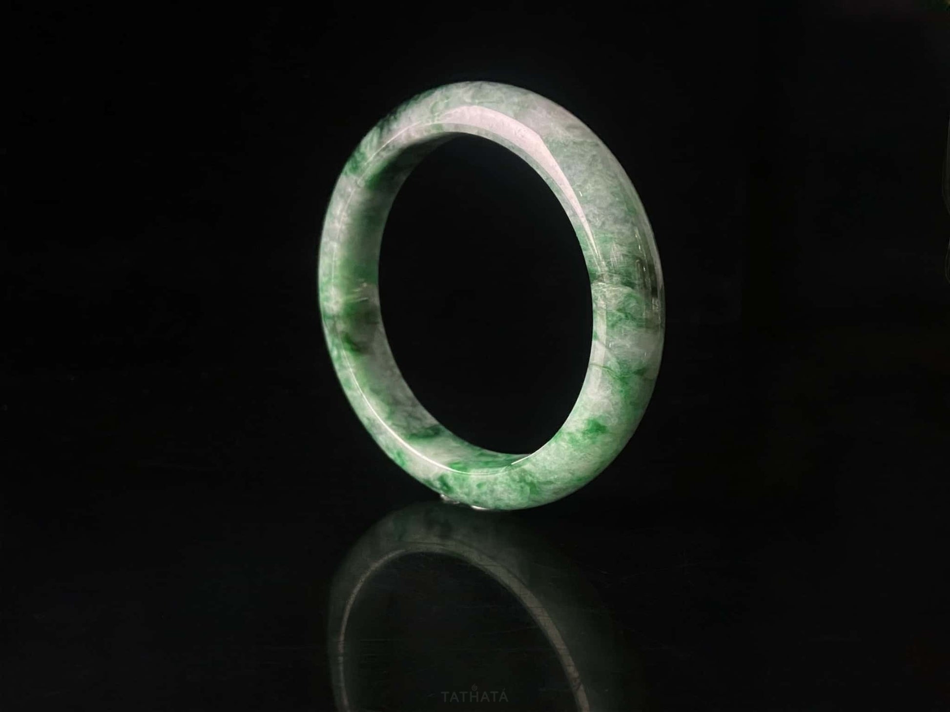 A mossy forest veil jadeite bangle.