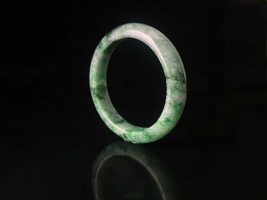 A mossy forest veil jadeite bangle.