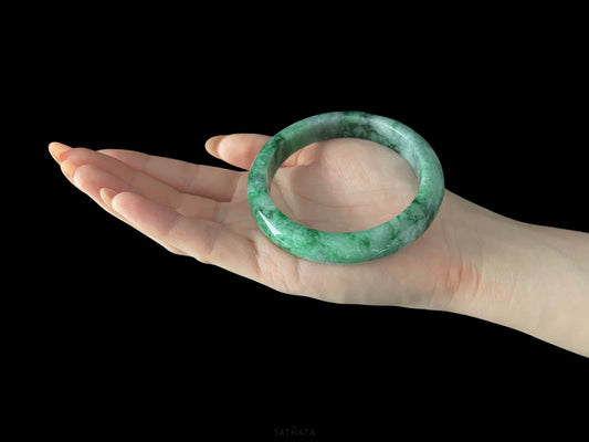 A mossy forest veil jadeite bangle.