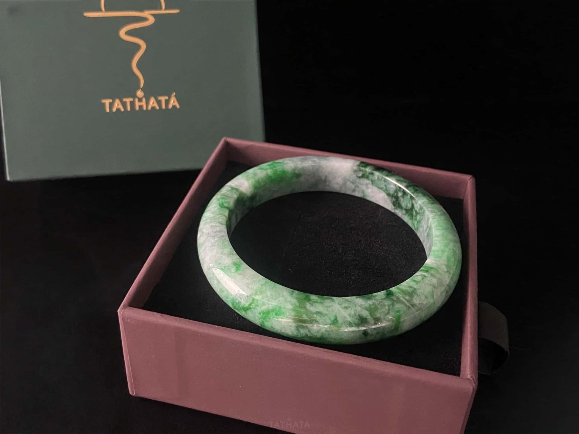 A mossy forest veil jadeite bangle.