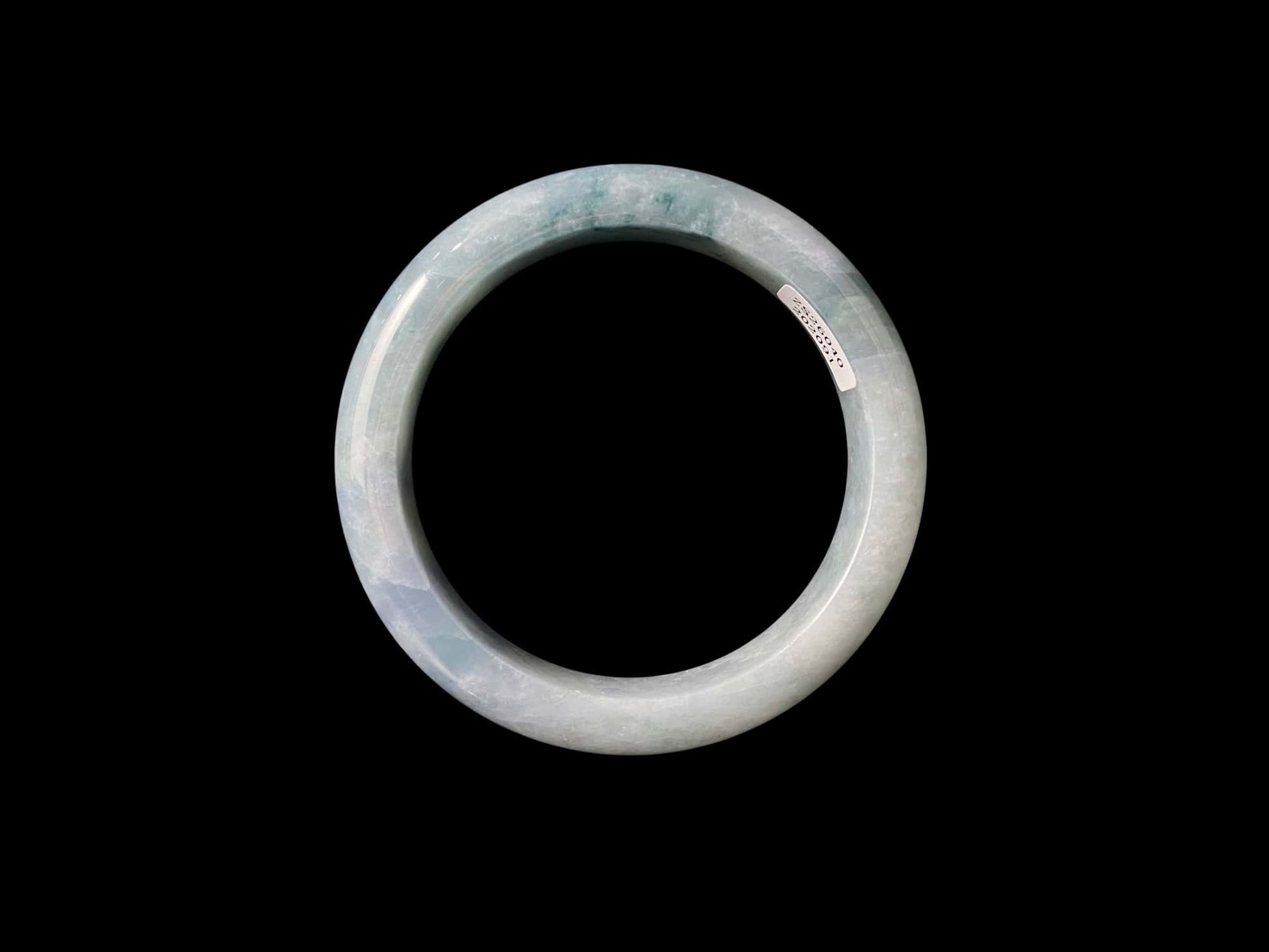A sky blue cloud jadeite bangle.