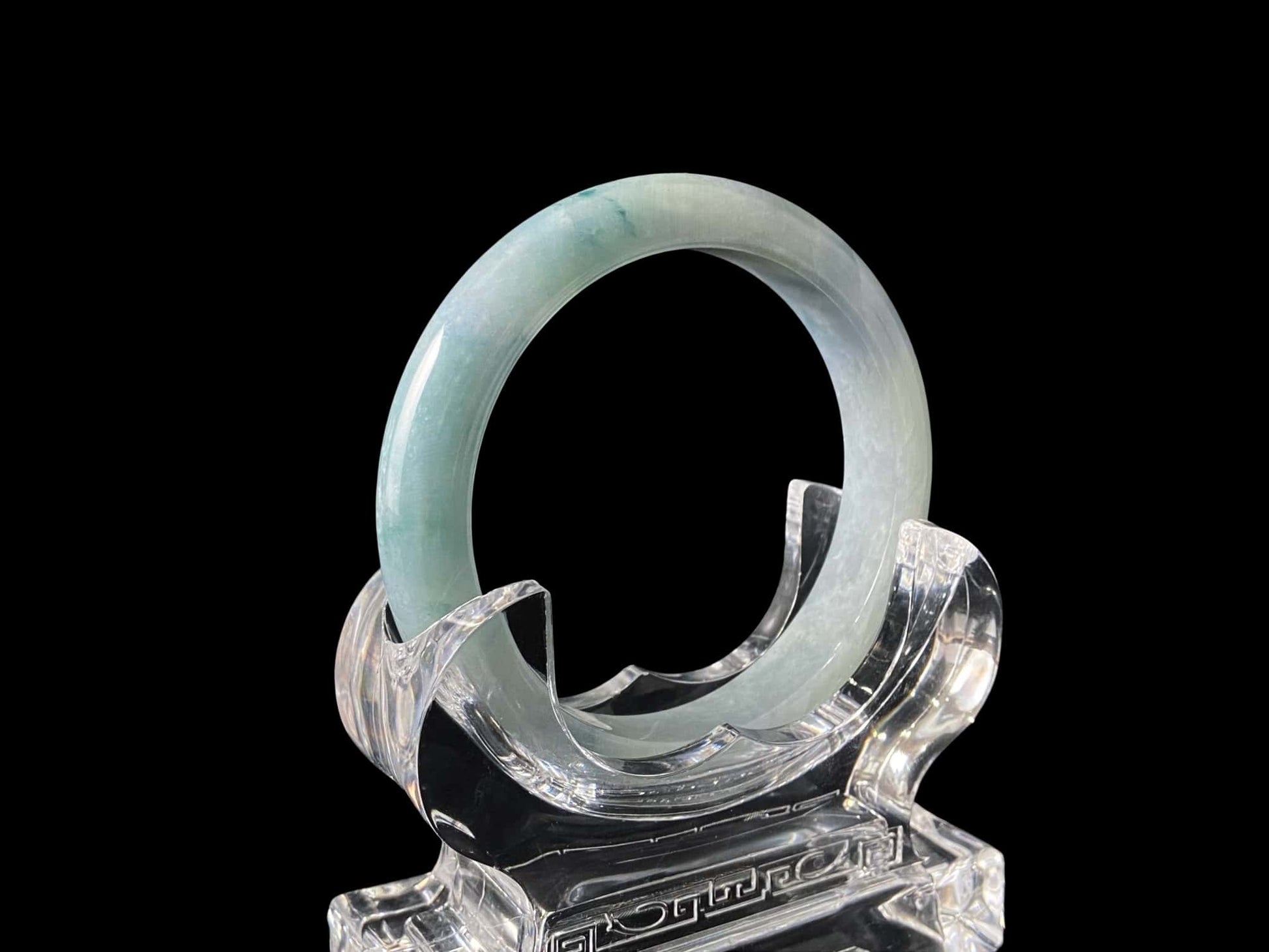A sky blue cloud jadeite bangle.