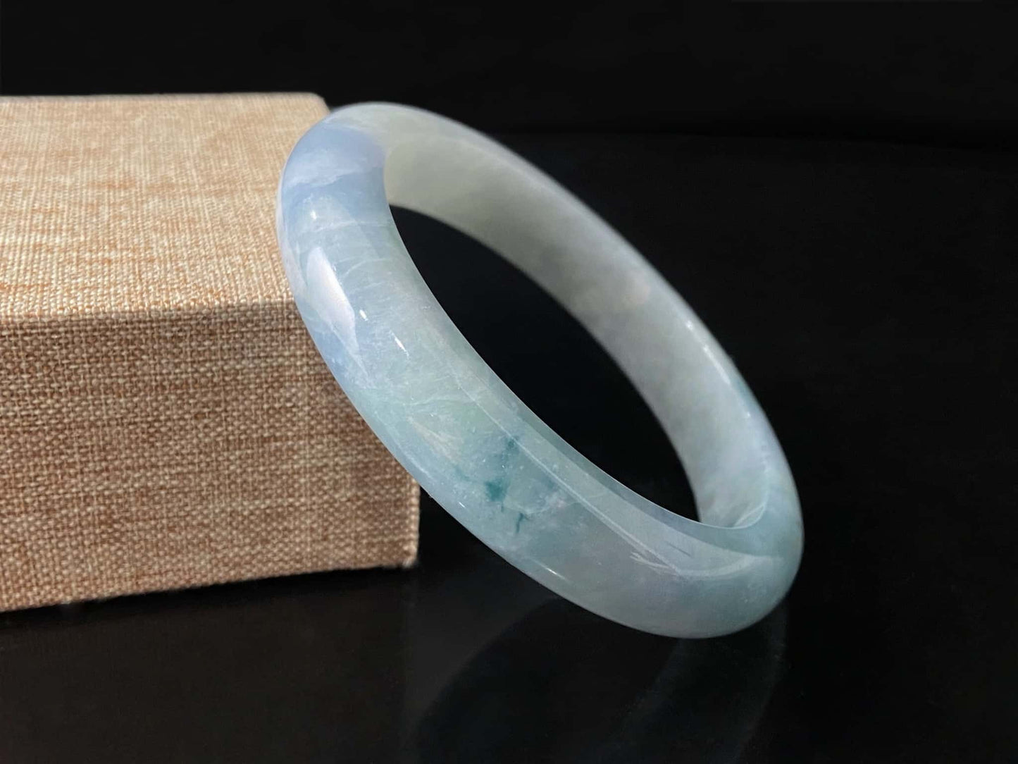 A sky blue cloud jadeite bangle.