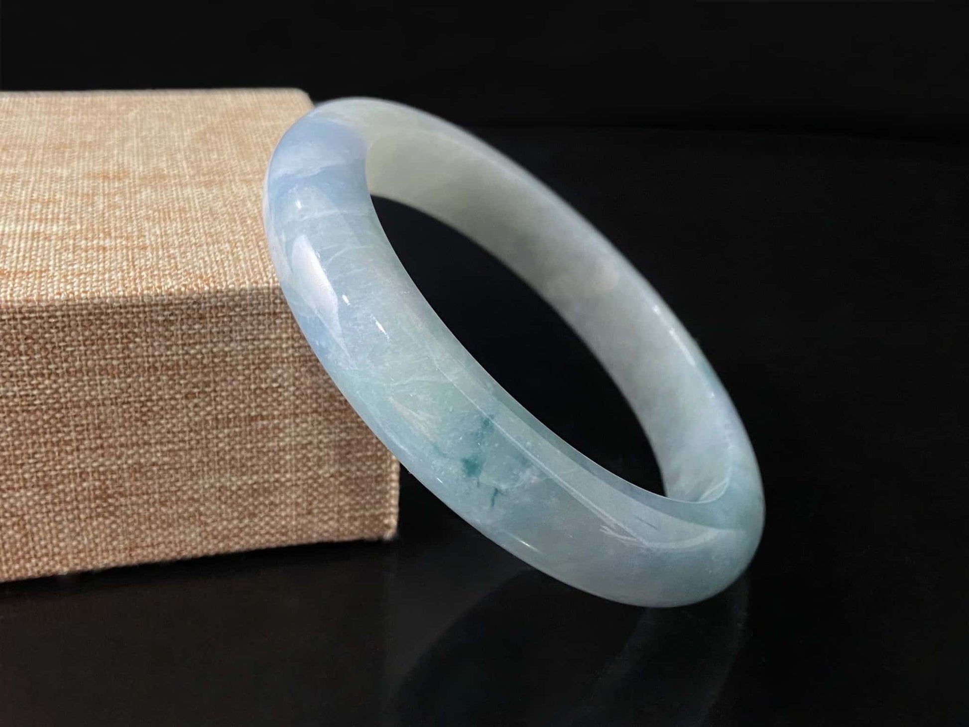 A sky blue cloud jadeite bangle.