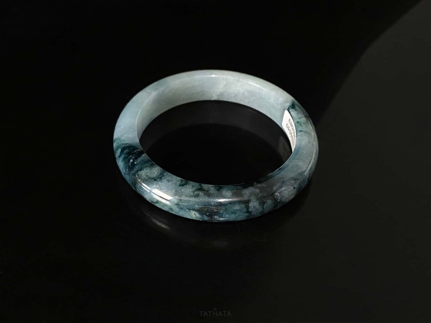 A blue dusk radiance jadeite bangle.