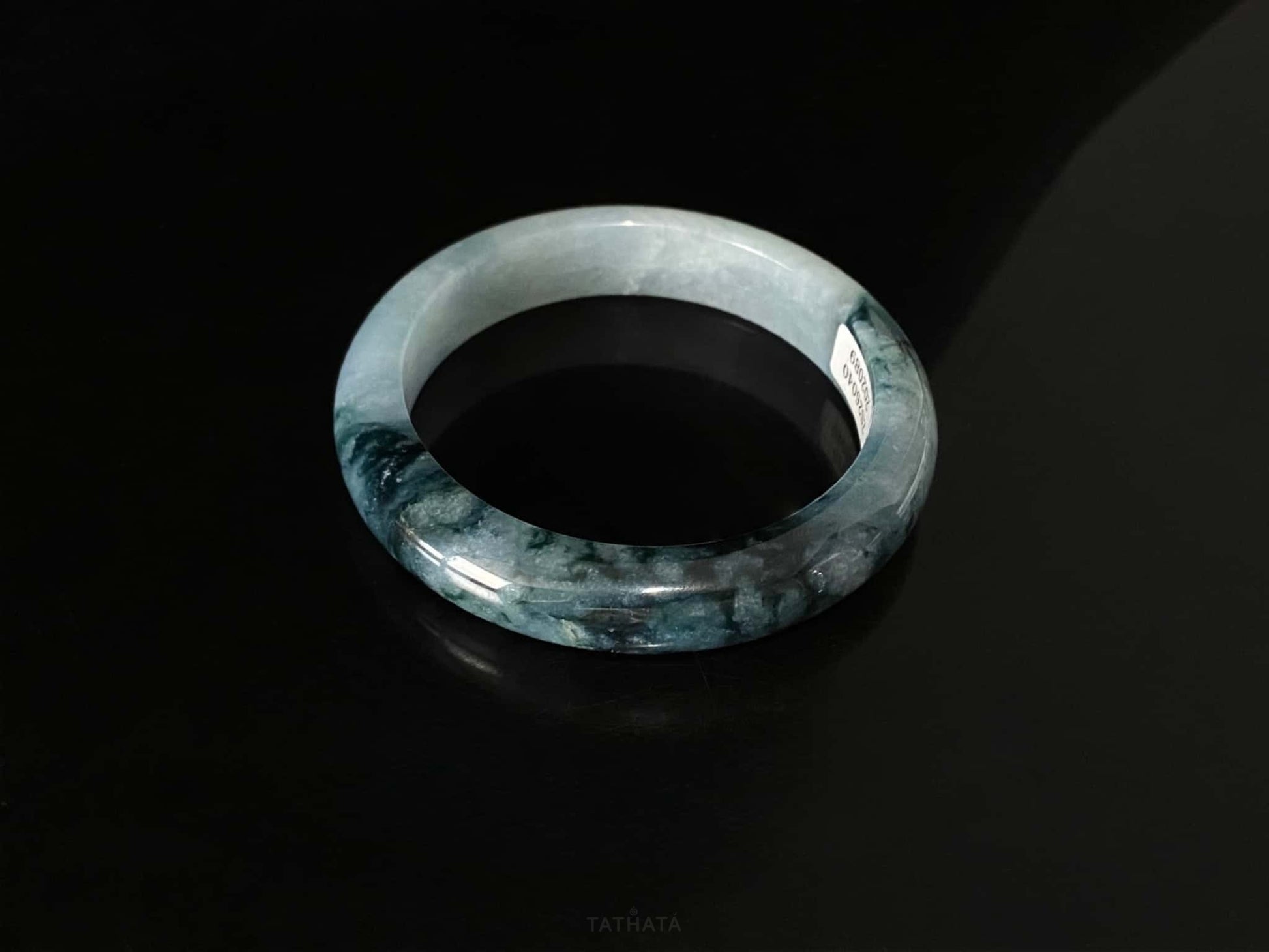 A blue dusk radiance jadeite bangle.