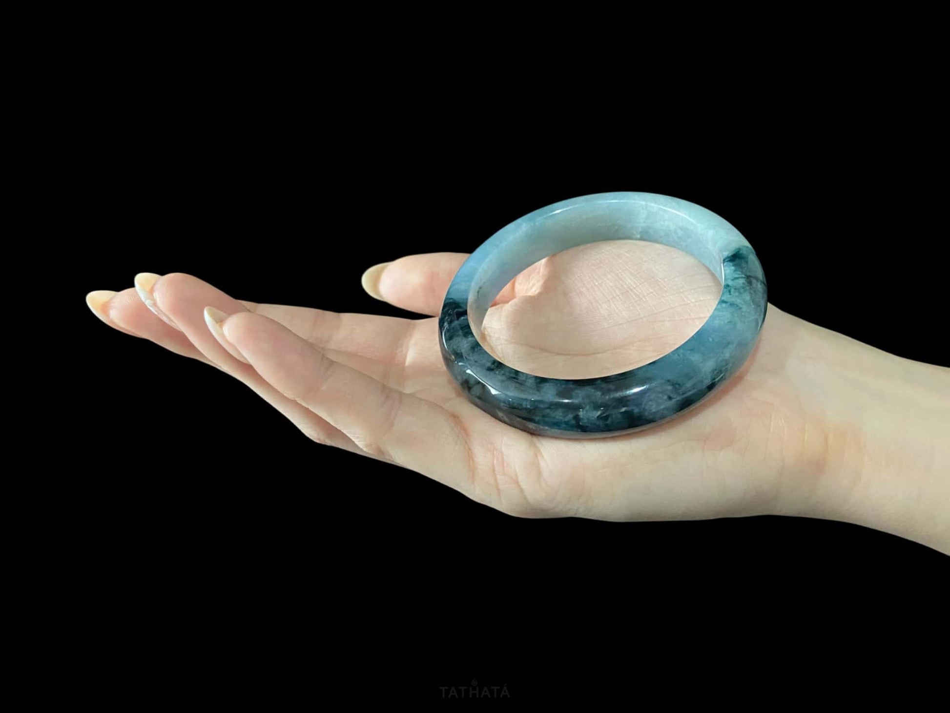 A blue dusk radiance jadeite bangle.