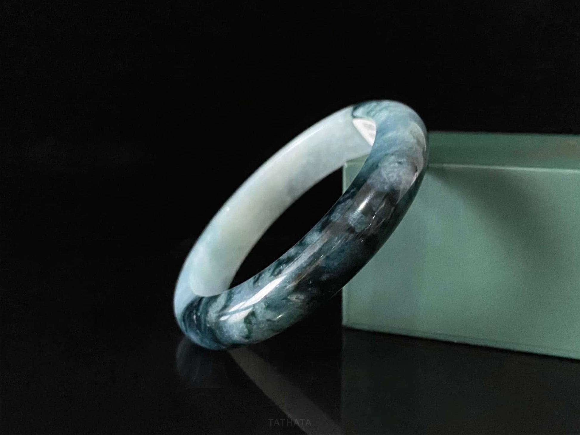 A blue dusk radiance jadeite bangle.