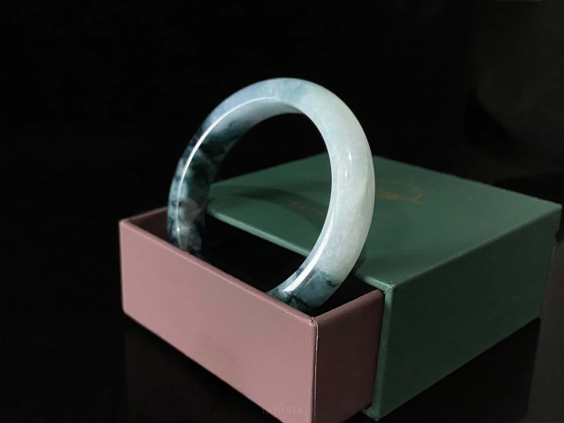 A blue dusk radiance jadeite bangle.