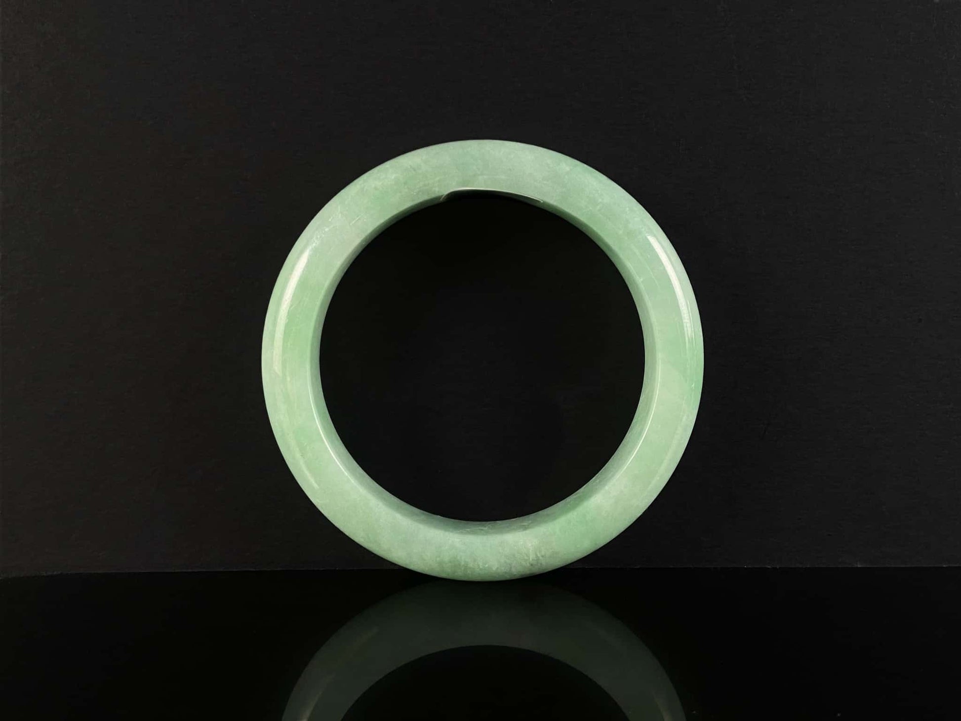 A pale spring green mist jadeite bangle.