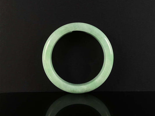 A pale spring green mist jadeite bangle.