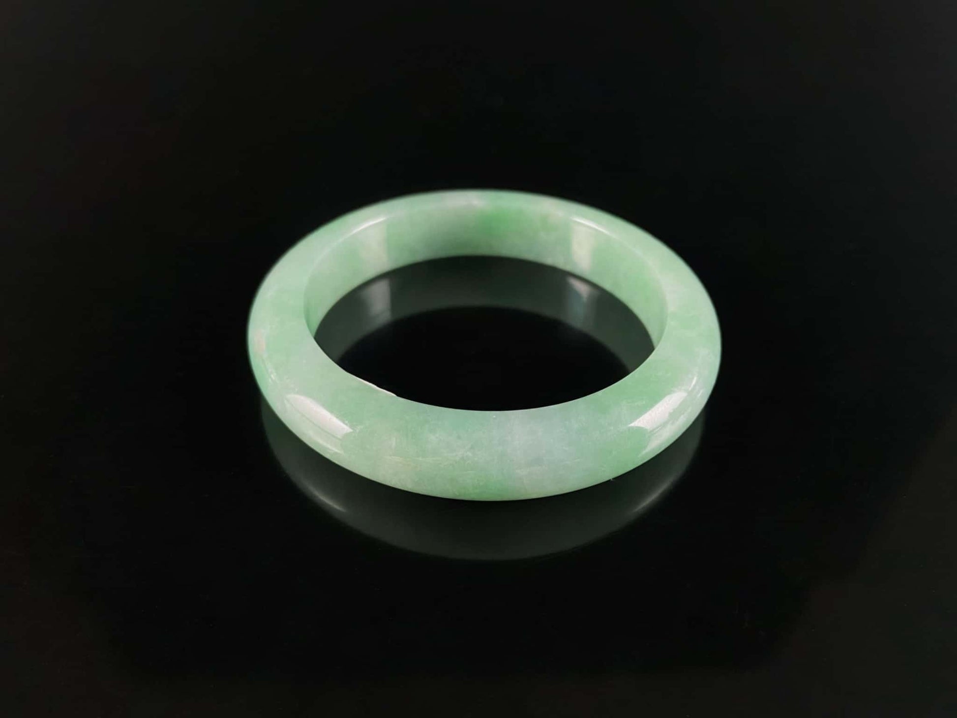 A pale spring green mist jadeite bangle.