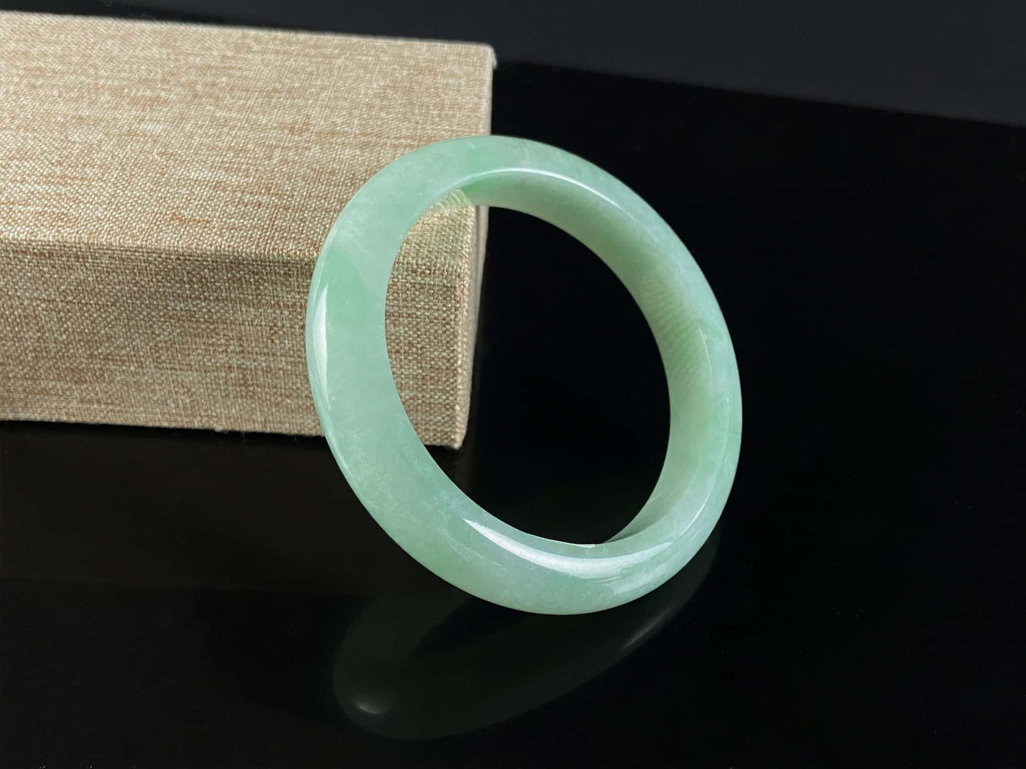 A pale spring green mist jadeite bangle.