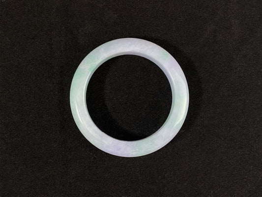 A mist lilac spring green jadeite bangle.