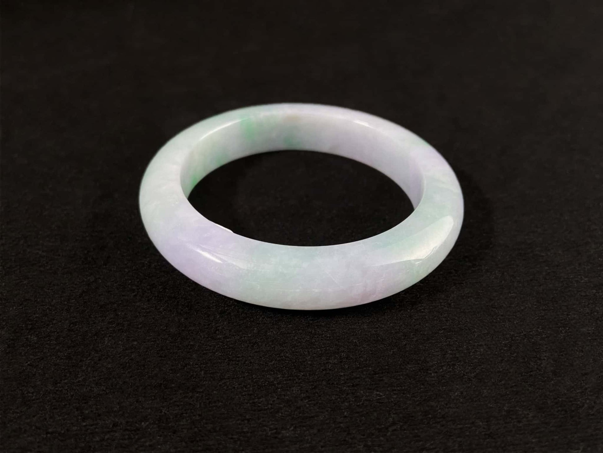 A mist lilac spring green jadeite bangle.