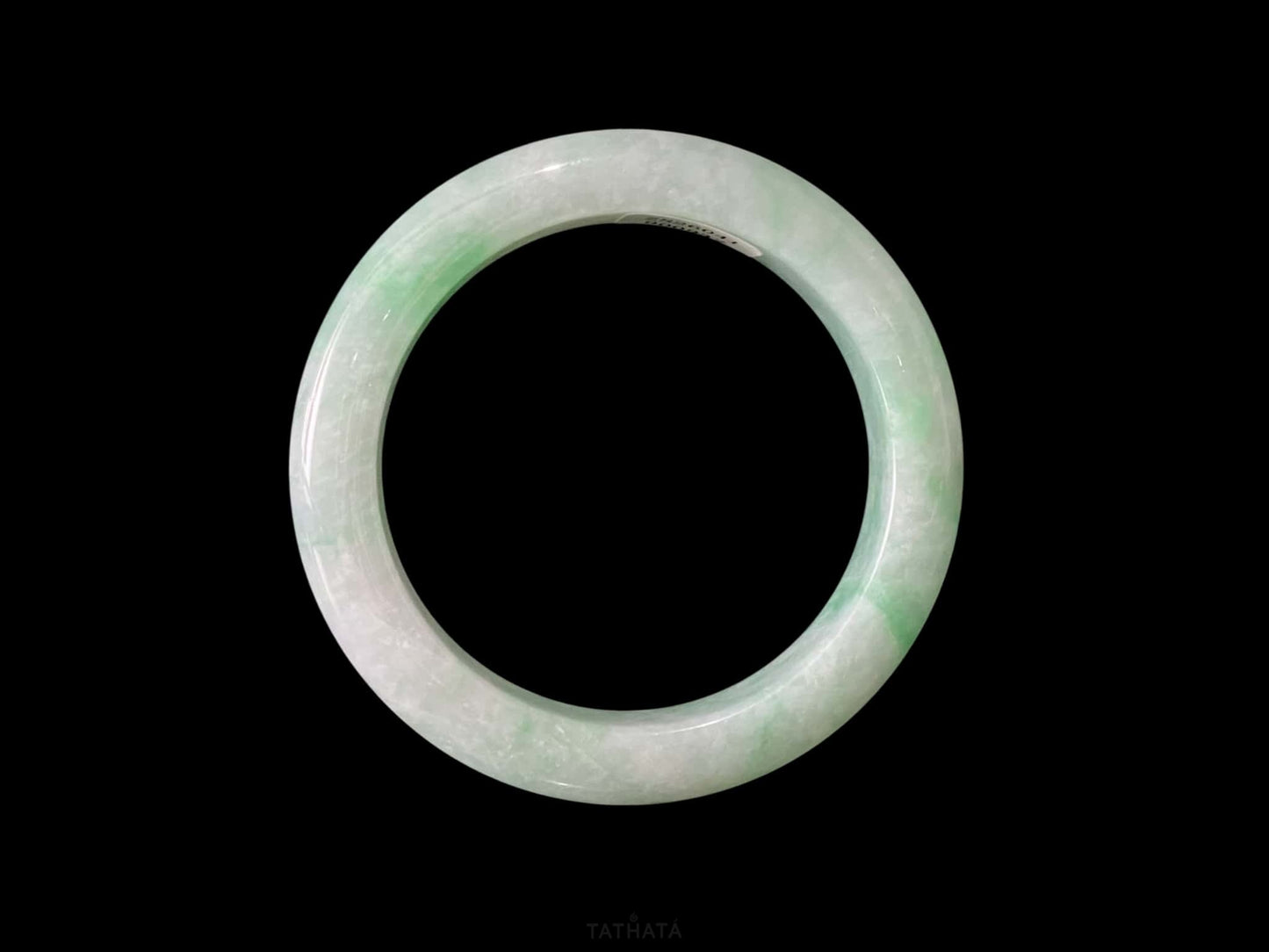 A moss green cloud  jadeite bangle.