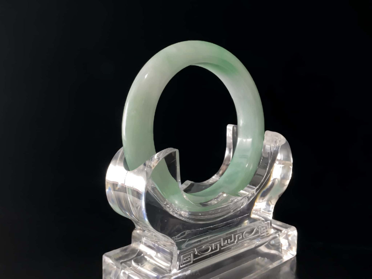 A moss green cloud  jadeite bangle.