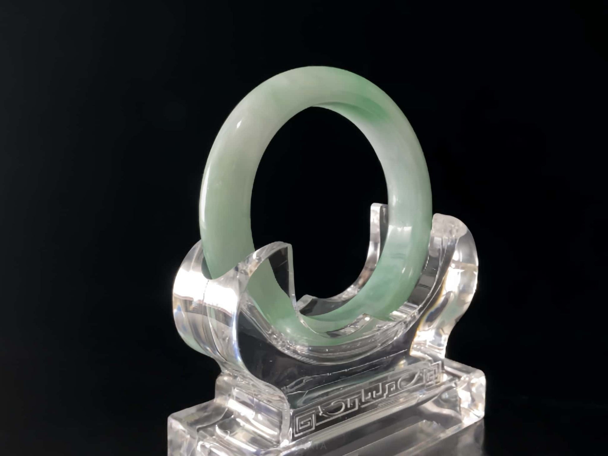 A moss green cloud  jadeite bangle.
