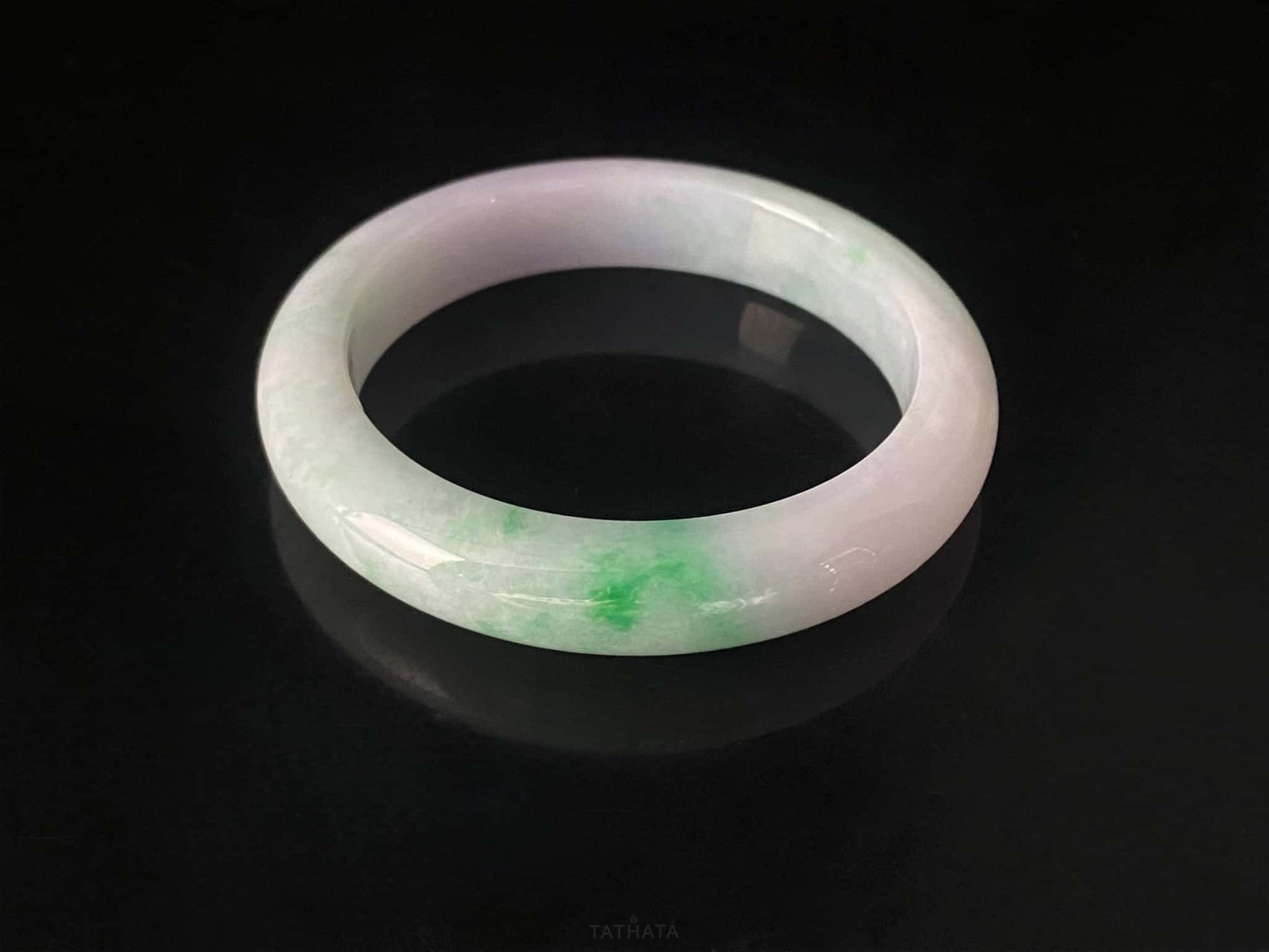 A lavender mint vein jadeite bangle.