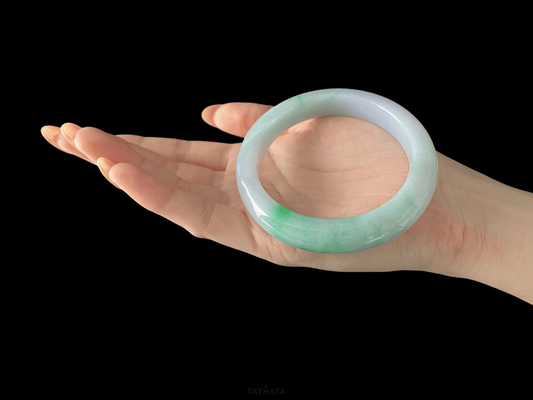 A lavender mint vein jadeite bangle.