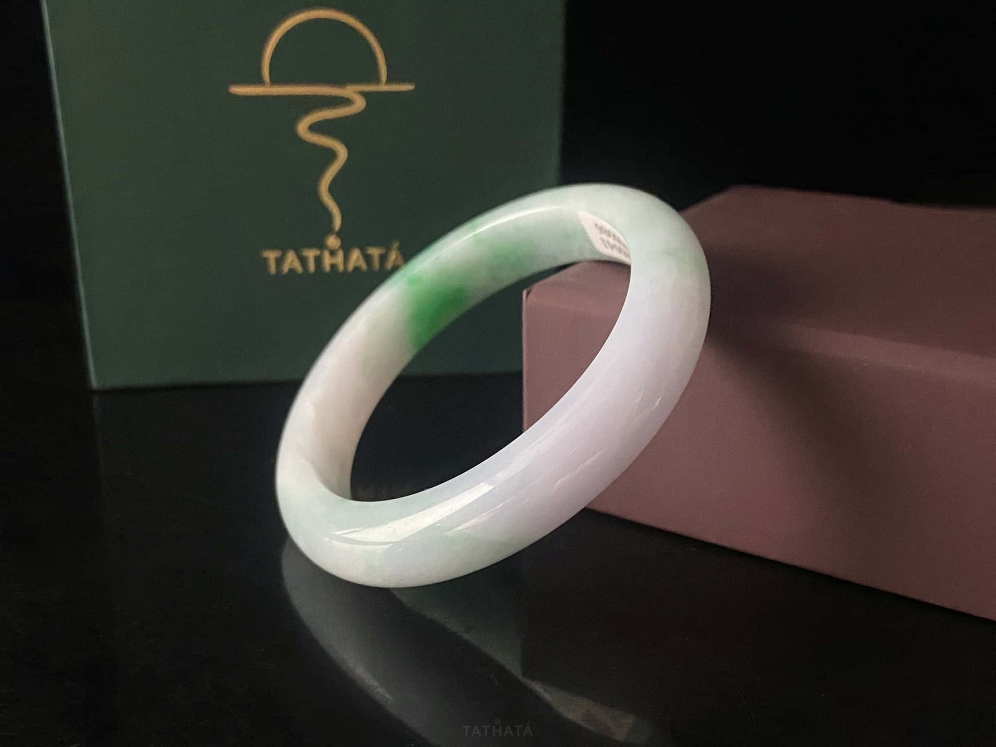 A lavender mint vein jadeite bangle.